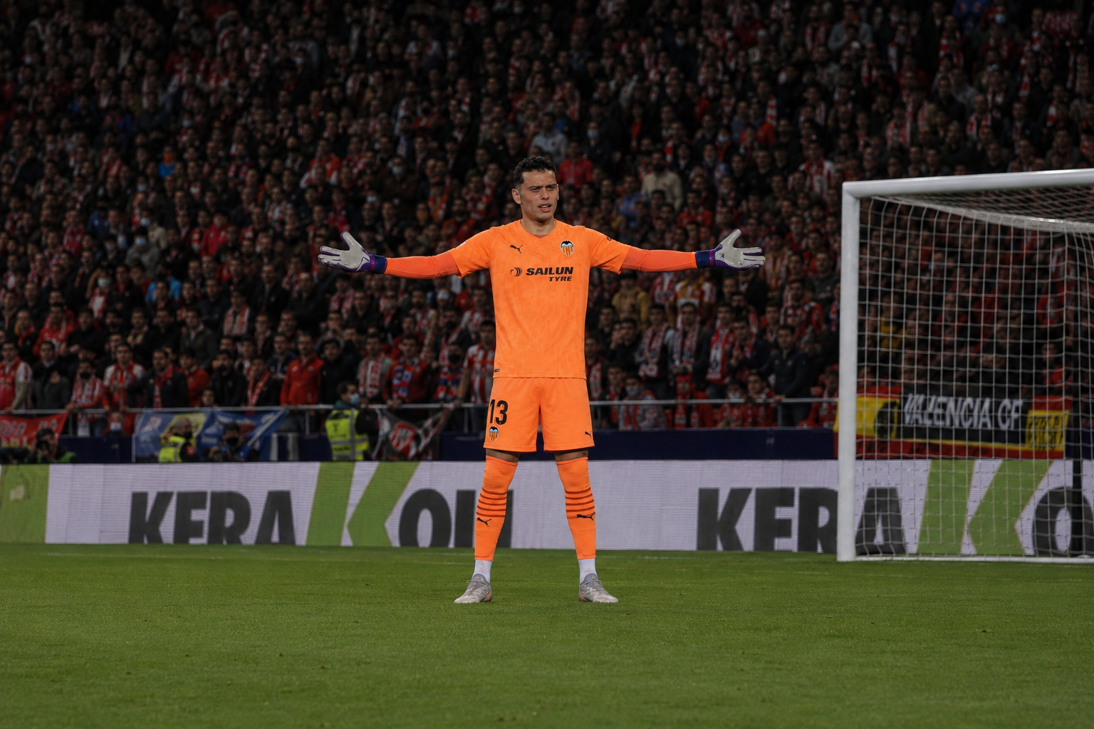 Bilal Jabri Jabri organising the defence as goalkeeper inside a professional football stadium